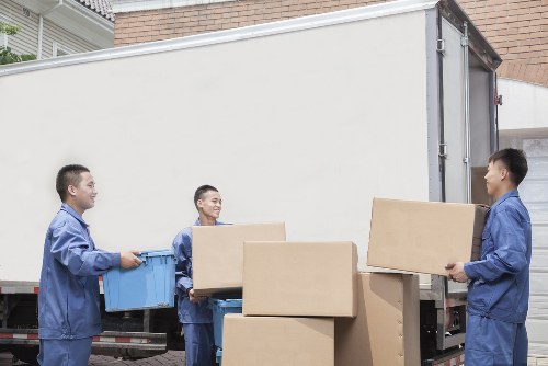 Staff moving office equipment through a Blackheath building